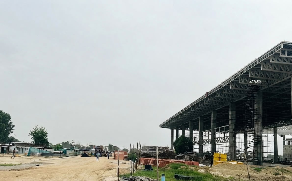 Agra Airport new terminal construction 2026 - full view showing massive steel roof structure