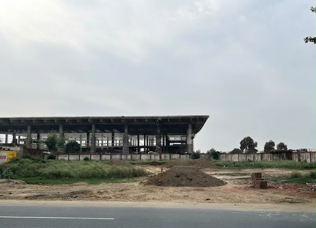 Agra Airport 2026 view from road showing new terminal building progress